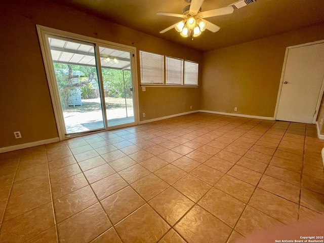 unfurnished room featuring light tile patterned floors, ceiling fan, visible vents, and baseboards