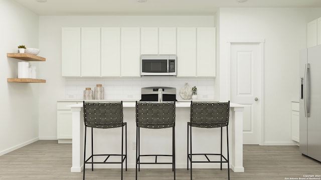 kitchen featuring tasteful backsplash, light countertops, white cabinetry, refrigerator with ice dispenser, and open shelves