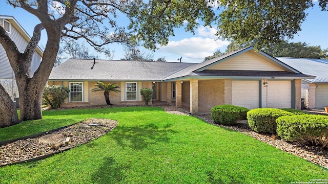 single story home featuring an attached garage, brick siding, roof with shingles, and a front yard