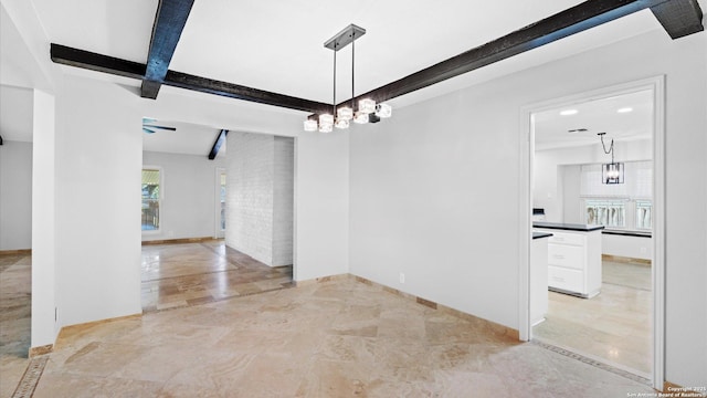 empty room with baseboards and beamed ceiling