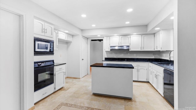 kitchen featuring under cabinet range hood, white cabinets, a center island, black appliances, and dark countertops