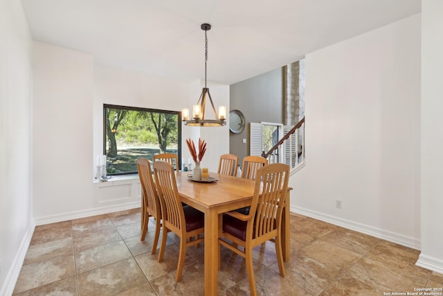 dining area with a chandelier, stairway, and baseboards