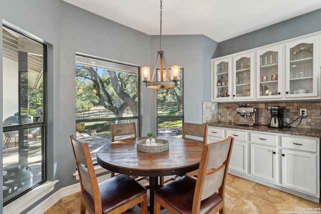 dining space with a chandelier