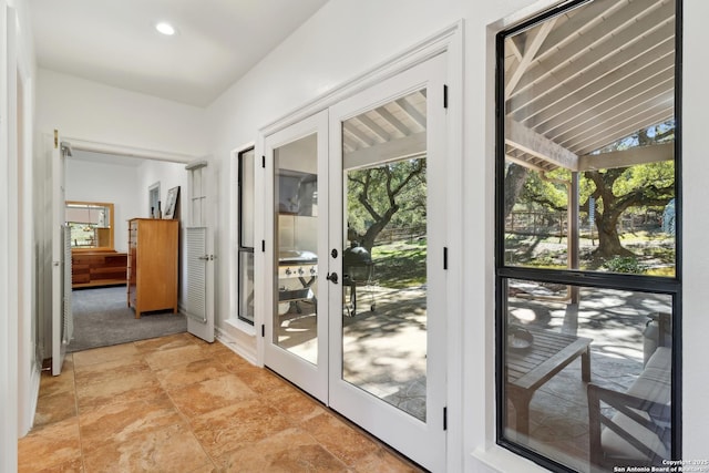 doorway to outside with recessed lighting and french doors