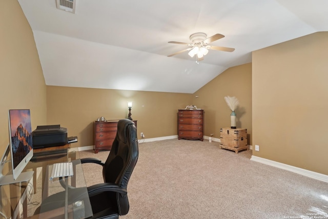 home office with carpet floors, lofted ceiling, visible vents, ceiling fan, and baseboards