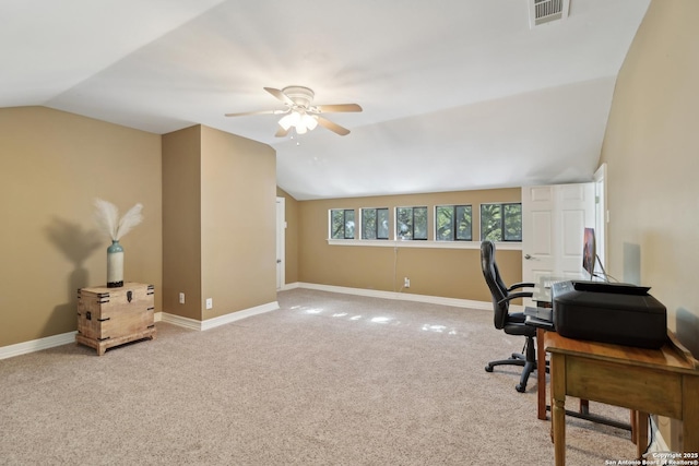 home office with carpet, baseboards, visible vents, and vaulted ceiling