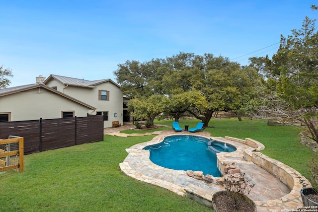 view of pool with fence, a lawn, and a patio