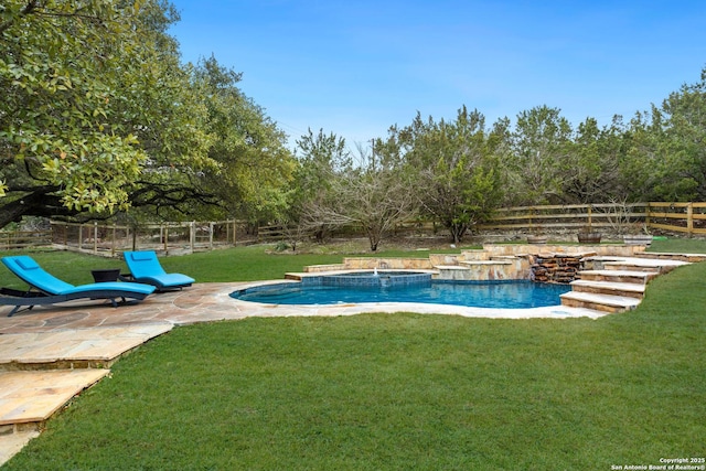 outdoor pool with an in ground hot tub, a fenced backyard, a patio, and a yard