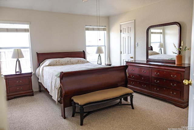 bedroom featuring light colored carpet