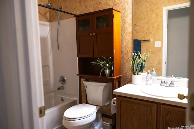 bathroom with toilet, tub / shower combination, and vanity