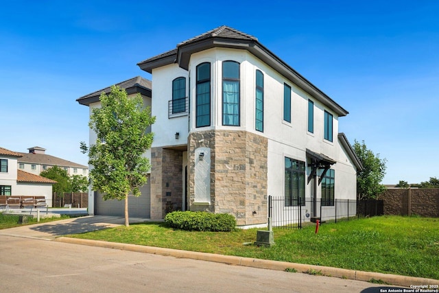 5219 Breeze Way, San Antonio, TX 78249 - view of side of property with stone siding, fence, stucco siding, driveway, and a garage