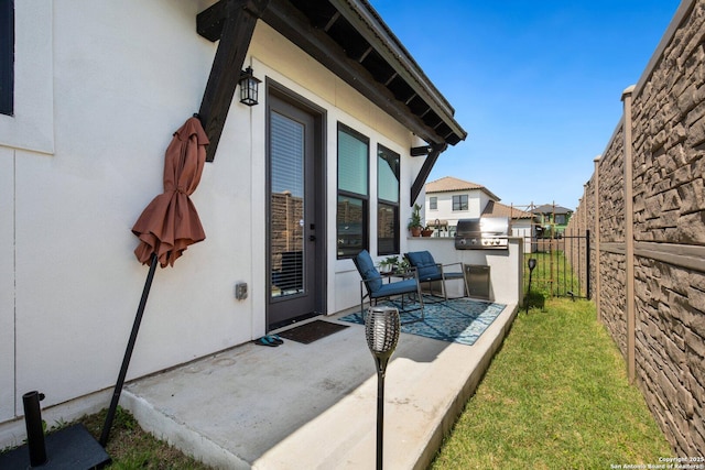 5219 Breeze Way, San Antonio, TX 78249 - view of patio / terrace featuring fence and a grill