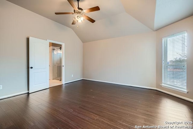 unfurnished room with lofted ceiling, baseboards, dark wood finished floors, and a ceiling fan