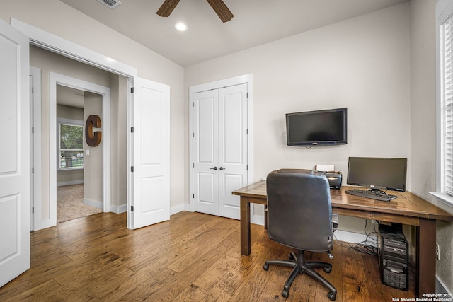 office featuring recessed lighting, ceiling fan, baseboards, and wood finished floors