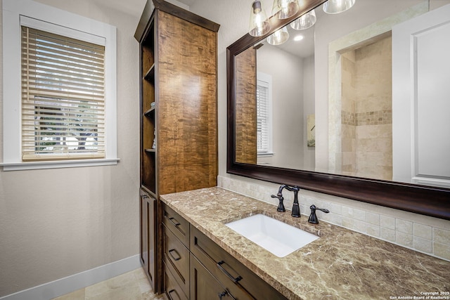 bathroom with vanity and baseboards