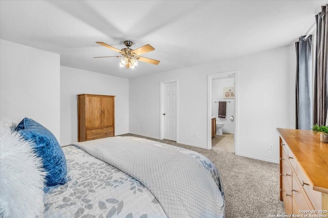 bedroom featuring light carpet, baseboards, a ceiling fan, and ensuite bathroom