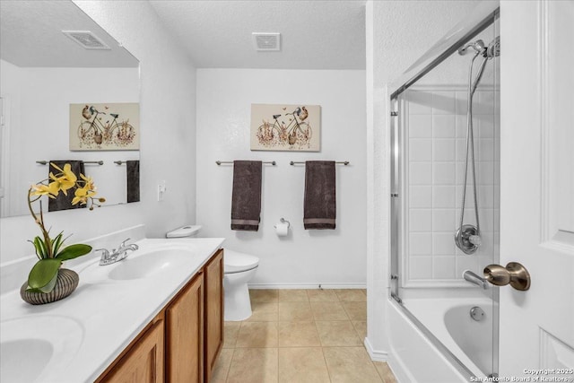 bathroom with double vanity, visible vents, toilet, washtub / shower combination, and a sink