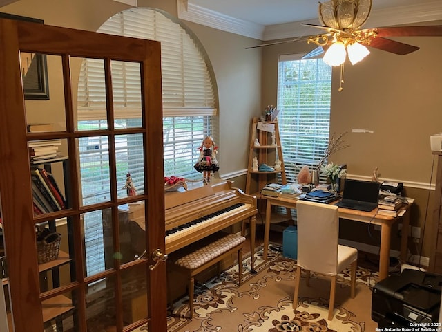 home office featuring a healthy amount of sunlight, crown molding, and ceiling fan