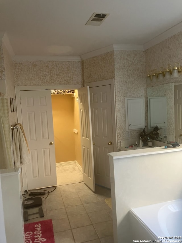 bathroom featuring ornamental molding, tile patterned floors, visible vents, and wallpapered walls