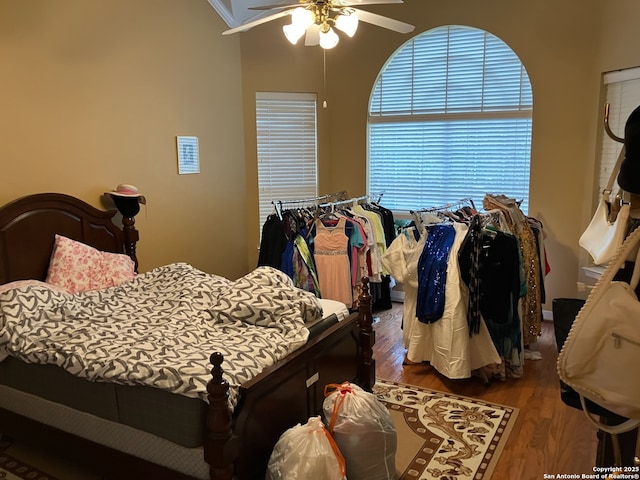 bedroom with ceiling fan and wood finished floors