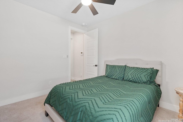 carpeted bedroom with baseboards and ceiling fan