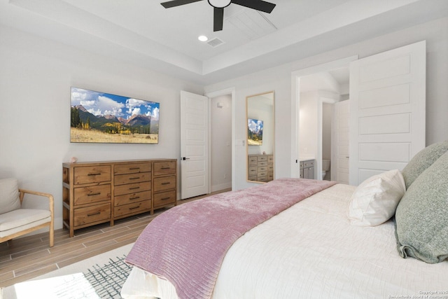 bedroom featuring wood finish floors, visible vents, recessed lighting, baseboards, and ceiling fan