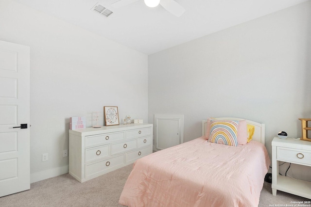 bedroom with visible vents, light carpet, baseboards, and a ceiling fan