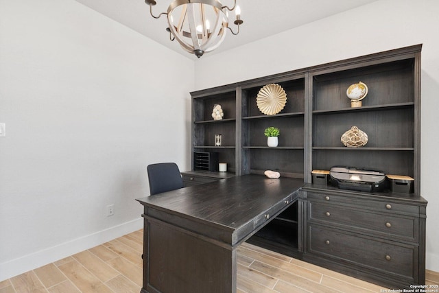 office area featuring a chandelier, baseboards, and wood tiled floor