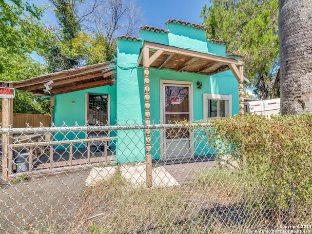 3315 Pitluk Ave, San Antonio, TX 78211 - view of side of home featuring fence and stucco siding