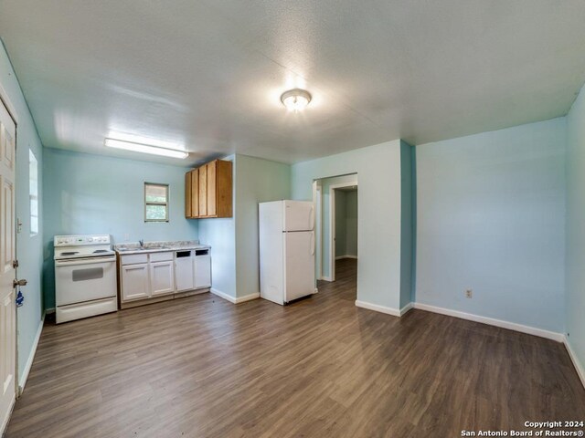 3315 Pitluk Ave, San Antonio, TX 78211 - kitchen with a sink, white appliances, light countertops, and dark wood finished floors