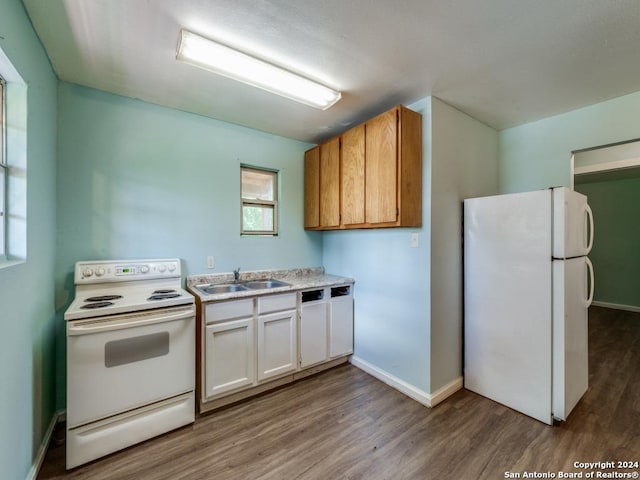 3315 Pitluk Ave, San Antonio, TX 78211 - kitchen featuring light countertops, white cabinetry, a sink, wood finished floors, and white appliances