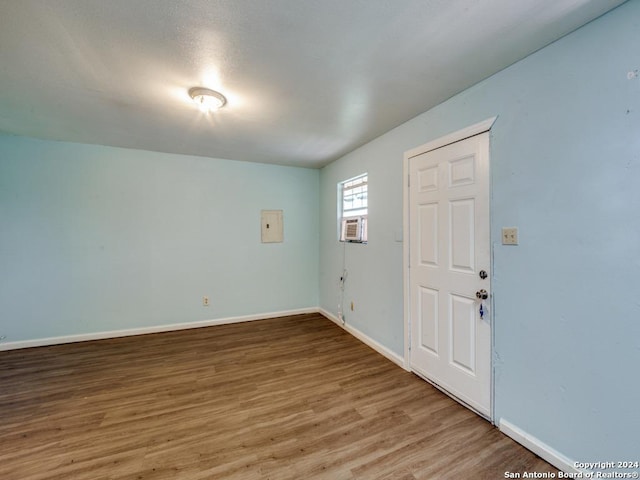 3315 Pitluk Ave, San Antonio, TX 78211 - empty room featuring cooling unit, baseboards, and wood finished floors