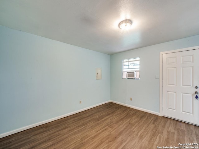3315 Pitluk Ave, San Antonio, TX 78211 - empty room with cooling unit, baseboards, and wood finished floors