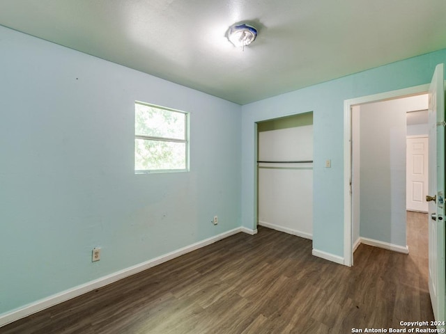 3315 Pitluk Ave, San Antonio, TX 78211 - unfurnished bedroom featuring dark wood-type flooring, a closet, and baseboards