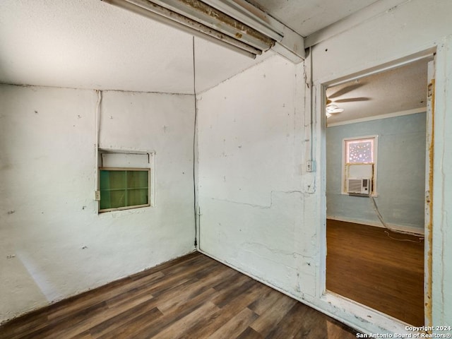 3315 Pitluk Ave, San Antonio, TX 78211 - empty room featuring dark wood-style floors, ornamental molding, and cooling unit