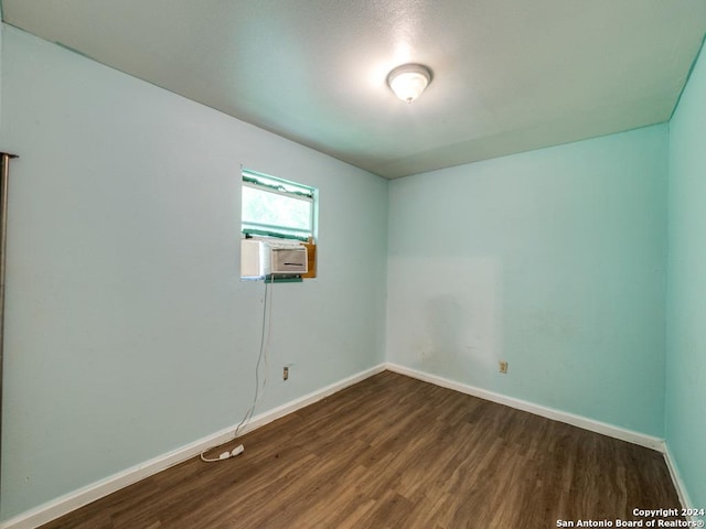 3315 Pitluk Ave, San Antonio, TX 78211 - empty room with dark wood-style floors, cooling unit, and baseboards