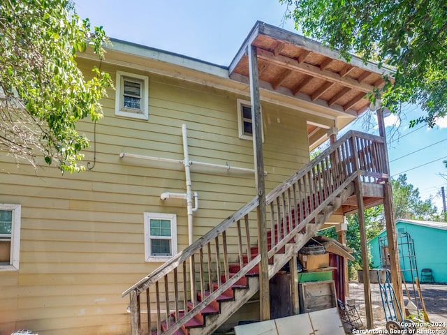 3315 Pitluk Ave, San Antonio, TX 78211 - view of home's exterior with a shed and stairway