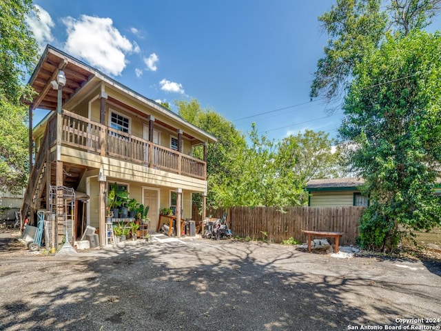 3315 Pitluk Ave, San Antonio, TX 78211 - rear view of house featuring a balcony and fence