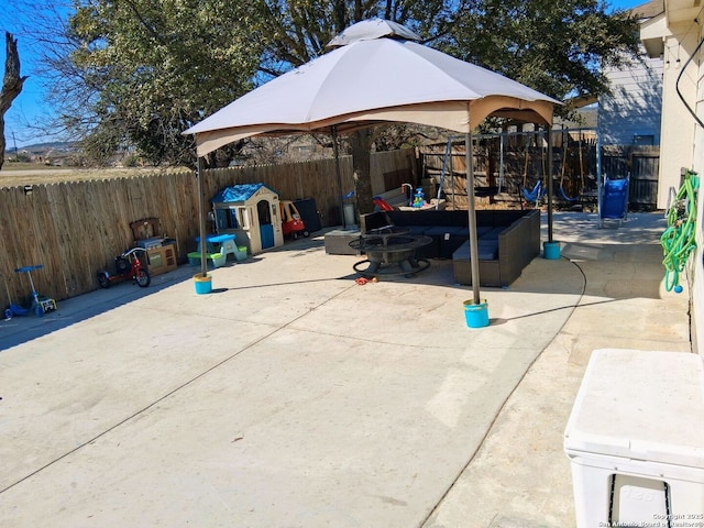 view of patio with a fenced backyard and a gazebo