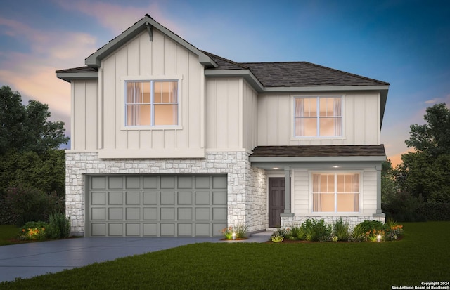 view of front of house with board and batten siding, driveway, and a garage