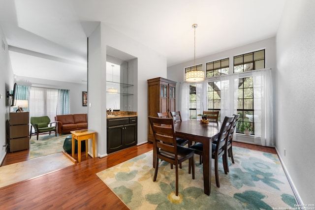 dining room featuring baseboards and wood finished floors