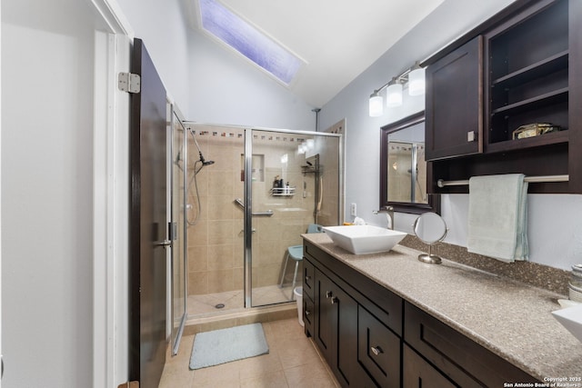 full bath with lofted ceiling, toilet, tile patterned floors, vanity, and a shower stall