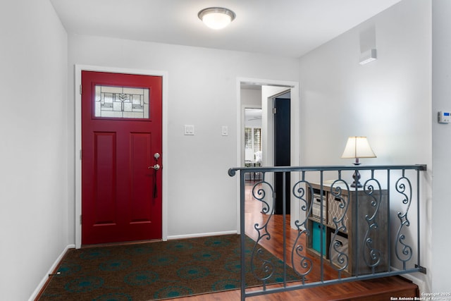 entryway featuring baseboards