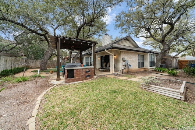 rear view of house with a chimney, fence, a lawn, and a pergola