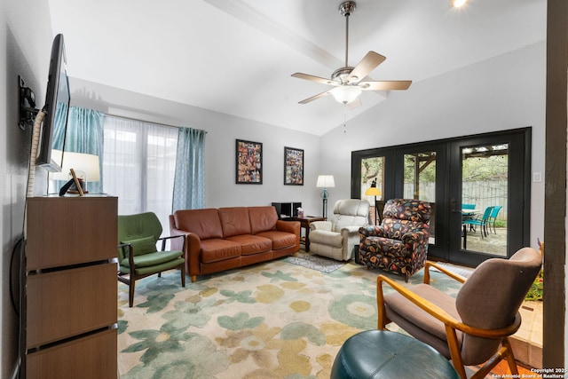 living area featuring a ceiling fan and vaulted ceiling