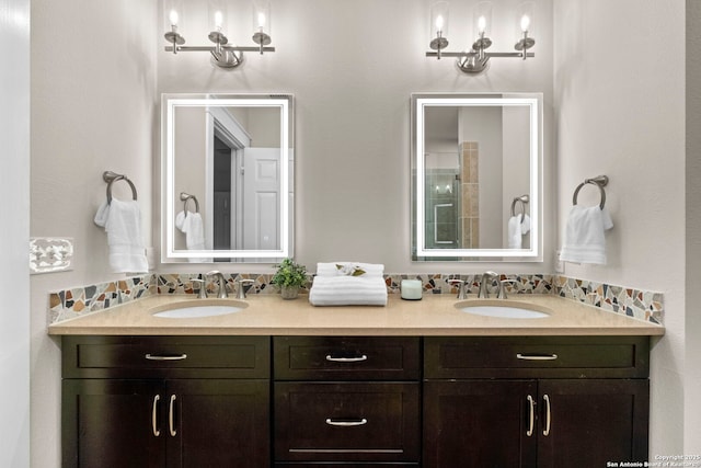 bathroom featuring double vanity, tasteful backsplash, and a sink