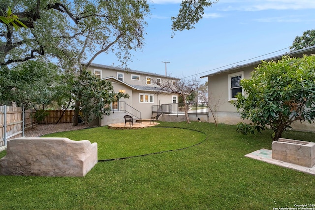 view of yard with a fenced backyard and a patio