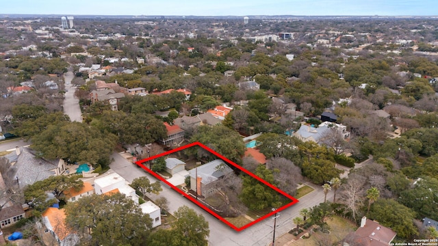 birds eye view of property with a residential view