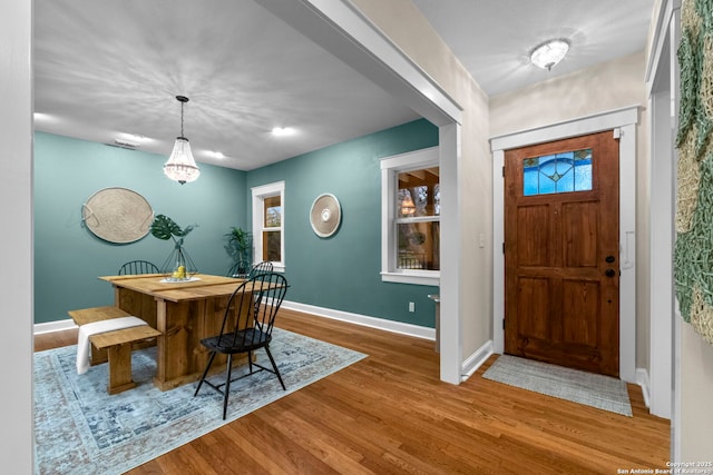 entryway featuring light wood-type flooring and baseboards