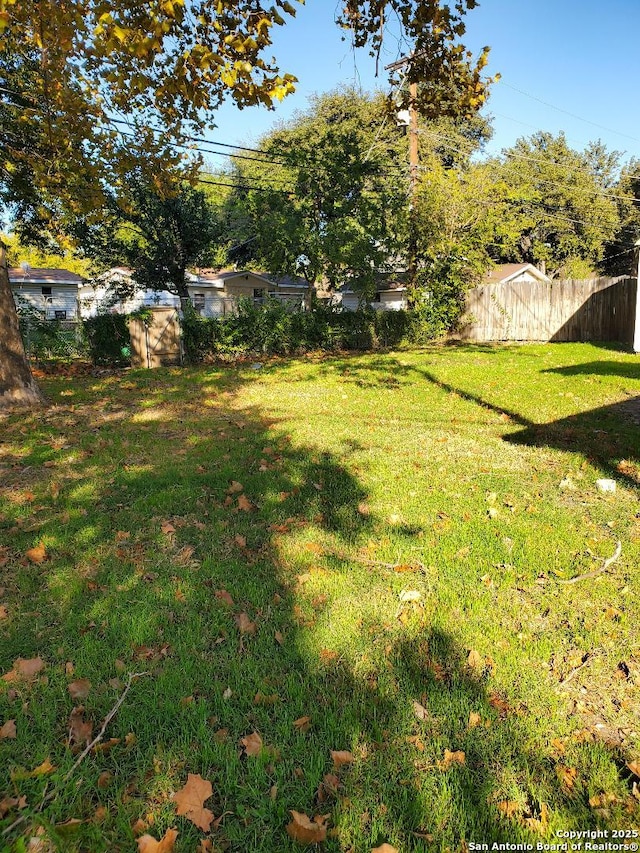 view of yard with fence